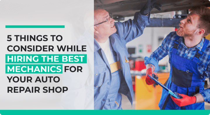 Two mechanics working on a vehicle