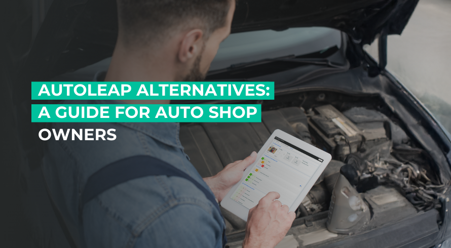 Mechanic holding a tab that displays AutoLeap's interface
